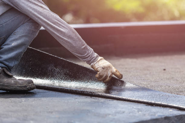 Professional Waterproofing technician working in Delong, IN